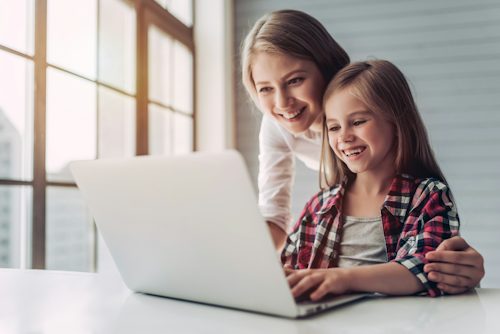 People using a laptop together at home